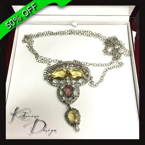 Fancy Intense Yellow And Purple Pear Shape Stone with Round Brilliant Cut Side Stones in .925 Sterling Silver